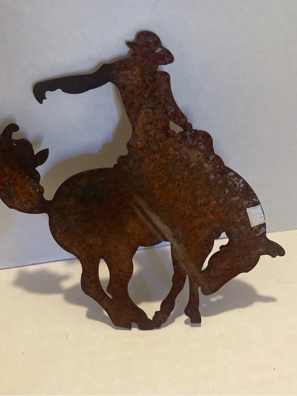 Vintage metal Rust Patina Cowboy Bucking Bronco